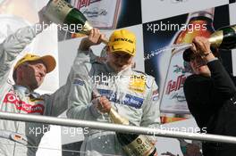 23.10.2005 Hockenheim, Germany,  Podium, new 2005 DTM champion, Gary Paffett (GBR), DaimlerChrysler Bank AMG-Mercedes, Portrait (center), gets a champaign shower - DTM 2005 at Hockenheimring (Deutsche Tourenwagen Masters)