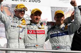 23.10.2005 Hockenheim, Germany,  Podium, Bernd Schneider (GER), Vodafone AMG-Mercedes, Portrait (1st, center), Jamie Green (GBR), Salzgitter AMG-Mercedes, Portrait (2nd, left) and Gary Paffett (GBR), DaimlerChrysler Bank AMG-Mercedes, Portrait (3rd, right) - DTM 2005 at Hockenheimring (Deutsche Tourenwagen Masters)