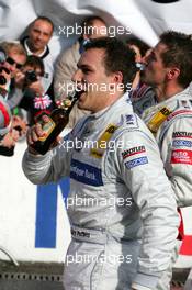 23.10.2005 Hockenheim, Germany,  New 2005 DTM champion Gary Paffett (GBR), DaimlerChrysler Bank AMG-Mercedes, Portrait, drinks from his own championship beer - DTM 2005 at Hockenheimring (Deutsche Tourenwagen Masters)
