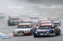 23.10.2005 Hockenheim, Germany,  Start of the race, with Tom Kristensen (DNK), Audi Sport Team Abt, Audi A4 DTM and Martin Tomczyk (GER), Audi Sport Team Abt Sportsline, Audi A4 DTM, side-by-side into the first corner - DTM 2005 at Hockenheimring (Deutsche Tourenwagen Masters)