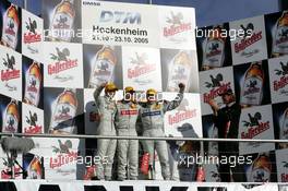 23.10.2005 Hockenheim, Germany,  Podium, Bernd Schneider (GER), Vodafone AMG-Mercedes, Portrait (1st, center), Jamie Green (GBR), Salzgitter AMG-Mercedes, Portrait (2nd, left) and Gary Paffett (GBR), DaimlerChrysler Bank AMG-Mercedes, Portrait (3rd, right) - DTM 2005 at Hockenheimring (Deutsche Tourenwagen Masters)