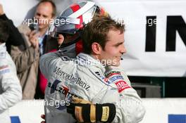 23.10.2005 Hockenheim, Germany,  Bernd Schneider (GER), Vodafone AMG-Mercedes, Portrait (1st) and Jamie Green (GBR), Salzgitter AMG-Mercedes, Portrait (2nd), congratulate each other - DTM 2005 at Hockenheimring (Deutsche Tourenwagen Masters)