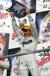 23.10.2005 Hockenheim, Germany,  Podium, Gary Paffett (GBR), DaimlerChrysler Bank AMG-Mercedes, Portrait, with the 2005 DTM Championship trophy - DTM 2005 at Hockenheimring (Deutsche Tourenwagen Masters)