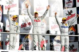 23.10.2005 Hockenheim, Germany,  Podium, Bernd Schneider (GER), Vodafone AMG-Mercedes, Portrait (1st, center), Jamie Green (GBR), Salzgitter AMG-Mercedes, Portrait (2nd, left) and Gary Paffett (GBR), DaimlerChrysler Bank AMG-Mercedes, Portrait (3rd, right) - DTM 2005 at Hockenheimring (Deutsche Tourenwagen Masters)