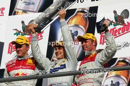 23.10.2005 Hockenheim, Germany,  Podium, the Top 3 of the 2005 DTM Championship, Gary Paffett (GBR), DaimlerChrysler Bank AMG-Mercedes, Portrait (1st, center), Mattias Ekström (SWE), Audi Sport Team Abt Sportsline, Portrait (2nd, left) and Tom Kristensen (DNK), Audi Sport Team Abt, Portrait (3rd, right) - DTM 2005 at Hockenheimring (Deutsche Tourenwagen Masters)