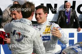 23.10.2005 Hockenheim, Germany,  Jamie Green (GBR), Salzgitter AMG-Mercedes, congratulates Gary Paffett (GBR), DaimlerChrysler Bank AMG-Mercedes, Portrait, with the 2005 DTM championship - DTM 2005 at Hockenheimring (Deutsche Tourenwagen Masters)