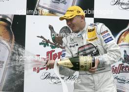 02.10.2005 Istanbul, Turkey, Podium, Mika Häkkinen (FIN), Sport Edition AMG-Mercedes, Portrait (2nd), spraying with champaign - DTM 2005 at Istanbul Otodromo Speed Park (Deutsche Tourenwagen Masters)