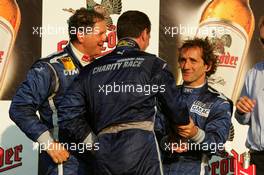 16.07.2005 Nürnberg, Germany,  Podium, Nigel Mansell (GBR) (center), congratulates Alain Prost (FRA) (right), with his victory. Far left: Jody Scheckter (RSA) - DTM 2005 Race of the Legends at Norisring (Deutsche Tourenwagen Masters)
