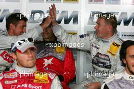 06.08.2005 Nürburg, Germany,  Bernd Schneider (GER), Vodafone AMG-Mercedes, Portrait (left) and Mika Häkkinen (FIN), Sport Edition AMG-Mercedes, Portrait (right), happy to still stay on pole position during the super pole qualifying session - DTM 2005 at Nürburgring (Deutsche Tourenwagen Masters)