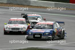 07.08.2005 Nürburg, Germany,  Mattias Ekström (SWE), Audi Sport Team Abt Sportsline, Audi A4 DTM, leads Bernd Schneider (GER), Vodafone AMG-Mercedes, AMG-Mercedes C-Klasse and Laurent Aiello (FRA), Opel Performance Center, Opel Vectra GTS V8 - DTM 2005 at Nürburgring (Deutsche Tourenwagen Masters)