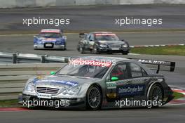 07.08.2005 Nürburg, Germany,  Gary Paffett (GBR), DaimlerChrysler Bank AMG-Mercedes, AMG-Mercedes C-Klasse, leads Mika Häkkinen (FIN), Sport Edition AMG-Mercedes, AMG-Mercedes C-Klasse and Mattias Ekström (SWE), Audi Sport Team Abt Sportsline, Audi A4 DTM - DTM 2005 at Nürburgring (Deutsche Tourenwagen Masters)