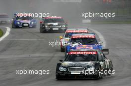 07.08.2005 Nürburg, Germany,  Mika Häkkinen (FIN), Sport Edition AMG-Mercedes, AMG-Mercedes C-Klasse, leads Mattias Ekström (SWE), Audi Sport Team Abt Sportsline, Audi A4 DTM, Bernd Schneider (GER), Vodafone AMG-Mercedes, AMG-Mercedes C-Klasse, Laurent Aiello (FRA), Opel Performance Center, Opel Vectra GTS V8 and Martin Tomczyk (GER), Audi Sport Team Abt Sportsline, Audi A4 DTM - DTM 2005 at Nürburgring (Deutsche Tourenwagen Masters)