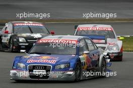 07.08.2005 Nürburg, Germany,  Mattias Ekström (SWE), Audi Sport Team Abt Sportsline, Audi A4 DTM, leads Bernd Schneider (GER), Vodafone AMG-Mercedes, AMG-Mercedes C-Klasse and Laurent Aiello (FRA), Opel Performance Center, Opel Vectra GTS V8 - DTM 2005 at Nürburgring (Deutsche Tourenwagen Masters)