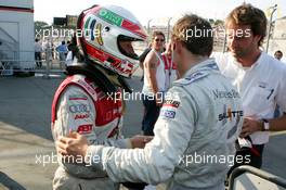 16.07.2005 Nürnberg, Germany,  Jamie Green (GBR), Salzgitter AMG-Mercedes (right), congratulates Tom Kristensen (DNK), Audi Sport Team Abt, Portrait (left) with his pole position - DTM 2005 at Norisring (Deutsche Tourenwagen Masters)