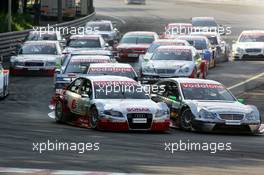 17.07.2005 Nürnberg, Germany,  Start of the race, with Tom Kristensen (DNK), Audi Sport Team Abt, Audi A4 DTM (left) and Gary Paffett (GBR), DaimlerChrysler Bank AMG-Mercedes, AMG-Mercedes C-Klasse (right), going into the first corner side-by-side - DTM 2005 at Norisring (Deutsche Tourenwagen Masters)