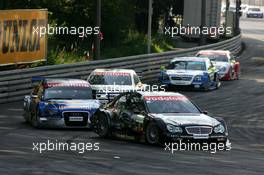 17.07.2005 Nürnberg, Germany,  Mika Häkkinen (FIN), Sport Edition AMG-Mercedes, AMG-Mercedes C-Klasse, leads Mattias Ekström (SWE), Audi Sport Team Abt Sportsline, Audi A4 DTM, Jamie Green (GBR), Salzgitter AMG-Mercedes, AMG-Mercedes C-Klasse, Manuel Reuter (GER), Opel Performance Center, Opel Vectra GTS V8 and Bernd Schneider (GER), Vodafone AMG-Mercedes, AMG-Mercedes C-Klasse - DTM 2005 at Norisring (Deutsche Tourenwagen Masters)