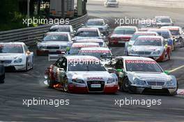 17.07.2005 Nürnberg, Germany,  Start of the race, with Tom Kristensen (DNK), Audi Sport Team Abt, Audi A4 DTM (left) and Gary Paffett (GBR), DaimlerChrysler Bank AMG-Mercedes, AMG-Mercedes C-Klasse (right), going into the first corner side-by-side - DTM 2005 at Norisring (Deutsche Tourenwagen Masters)