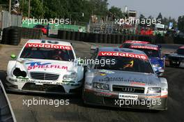 17.07.2005 Nürnberg, Germany,  Pierre Kaffer (GER), Audi Sport Team Joest Racing, Audi A4 DTM, forces Stefan Mücke (GER), Mücke Motorsport, AMG-Mercedes C-Klasse, into the armco barriers at the exit of the hairpin - DTM 2005 at Norisring (Deutsche Tourenwagen Masters)