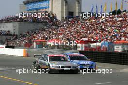 17.07.2005 Nürnberg, Germany,  Pierre Kaffer (GER), Audi Sport Team Joest Racing, Audi A4 DTM and Marcel Fässler (SUI), Opel Performance Center, Opel Vectra GTS V8, side-by-side on the main start-finish straight - DTM 2005 at Norisring (Deutsche Tourenwagen Masters)