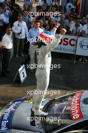 17.07.2005 Nürnberg, Germany,  Race winner Gary Paffett (GBR), DaimlerChrysler Bank AMG-Mercedes, Portrait, standing on his car - DTM 2005 at Norisring (Deutsche Tourenwagen Masters)