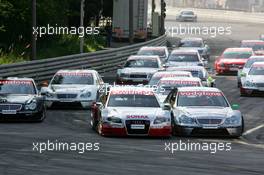 17.07.2005 Nürnberg, Germany,  Start of the race, with Tom Kristensen (DNK), Audi Sport Team Abt, Audi A4 DTM (left) and Gary Paffett (GBR), DaimlerChrysler Bank AMG-Mercedes, AMG-Mercedes C-Klasse (right), going into the first corner side-by-side - DTM 2005 at Norisring (Deutsche Tourenwagen Masters)