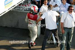 17.07.2005 Nürnberg, Germany,  A dissapointed Tom Kristensen (DNK), Audi Sport Team Abt, being escorted from the Parc Ferme - DTM 2005 at Norisring (Deutsche Tourenwagen Masters)