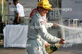 17.07.2005 Nürnberg, Germany,  Podium, Gary Paffett (GBR), DaimlerChrysler Bank AMG-Mercedes, Portrait (1st), spraying champaign - DTM 2005 at Norisring (Deutsche Tourenwagen Masters)