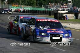 17.07.2005 Nürnberg, Germany,  Mattias Ekström (SWE), Audi Sport Team Abt Sportsline, Audi A4 DTM, leads Bernd Schneider (GER), Vodafone AMG-Mercedes, AMG-Mercedes C-Klasse - DTM 2005 at Norisring (Deutsche Tourenwagen Masters)