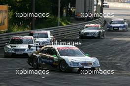 17.07.2005 Nürnberg, Germany,  Gary Paffett (GBR), DaimlerChrysler Bank AMG-Mercedes, AMG-Mercedes C<-Klasse, leads Jean Alesi (FRA), AMG-Mercedes, AMG-Mercedes C-Klasse, Tom Kristensen (DNK), Audi Sport Team Abt, Audi A4 DTM, Mika Häkkinen (FIN), Sport Edition AMG-Mercedes, AMG-Mercedes C-Klasse and Mattias Ekström (SWE), Audi Sport Team Abt Sportsline, Audi A4 DTM - DTM 2005 at Norisring (Deutsche Tourenwagen Masters)