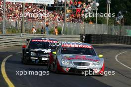 17.07.2005 Nürnberg, Germany,  Bernd Schneider (GER), Vodafone AMG-Mercedes, AMG-Mercedes C-Klasse, leads Laurent Aiello (FRA), Opel Performance Center, Opel Vectra GTS V8 - DTM 2005 at Norisring (Deutsche Tourenwagen Masters)