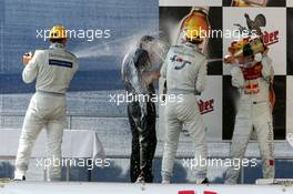 26.06.2005 Oschersleben, Germany,  Hans-Jürgen Mattheis (GER), Team Manager HWA (center), gets a professional champaign shower from Gary Paffett (GBR), DaimlerChrysler Bank AMG-Mercedes (1st, left), Jamie Green (GBR), Salzgitter AMG-Mercedes (3rd, center) and Mattias Ekström (SWE), Audi Sport Team Abt Sportsline, Portrait (2nd, right) - DTM 2005 at Motopark Oschersleben (Deutsche Tourenwagen Masters)