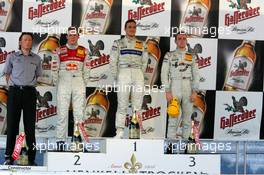 26.06.2005 Oschersleben, Germany,  Podium, Gary Paffett (GBR), DaimlerChrysler Bank AMG-Mercedes, Portrait (1st, center), Mattias Ekström (SWE), Audi Sport Team Abt Sportsline, Portrait (2nd, left) and Jamie Green (GBR), Salzgitter AMG-Mercedes, Portrait (3rd, right). Far left: Hans-Jürgen Mattheis (GER), Team Manager HWA - DTM 2005 at Motopark Oschersleben (Deutsche Tourenwagen Masters)