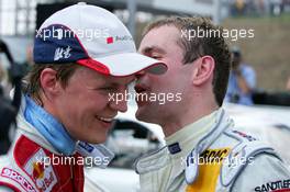 26.06.2005 Oschersleben, Germany,  Mattias Ekström (SWE), Audi Sport Team Abt Sportsline, Portrait (2nd. left) and Jamie Green (GBR), Salzgitter AMG-Mercedes, Portrait (3rd, right), discuss the race - DTM 2005 at Motopark Oschersleben (Deutsche Tourenwagen Masters)