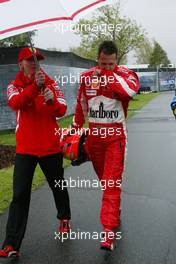 05.03.2005 Melbourne, Australia, Michael Schumacher, GER, Ferrari walking back after Q. - left: Sabine Kehm, Michael Schumacher's personal press officer - Saturday, March, Formula 1 World Championship, Rd 1, Australian Grand Prix, Qualifying