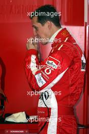 28.01.2005 Barcelona, Spain, MS is preparing his ear plugs - First Roll Out of the Ferrari with the new aerodynamic wings / F2004M pre version - Michael Schumacher, GER, Ferrari - Friday, January, Formula 1 Testing, Circuit de Catalunya (ESP)