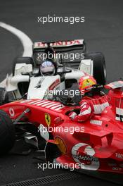 11.09.2005 Spa Francorchamps, Belgium,  Michael Schumacher, GER, Scuderia Ferrari Marlboro, F2005, Action, Track and Takuma Sato, JPN,  BAR Honda crashed at turn 1 - September, Formula 1 World Championship, Rd 16, Belgian Grand Prix, Sunday Race