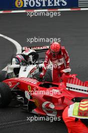 11.09.2005 Spa Francorchamps, Belgium,  Michael Schumacher, GER, Scuderia Ferrari Marlboro, F2005, Action, Track and Takuma Sato, JPN,  BAR Honda crashed at turn 1 - September, Formula 1 World Championship, Rd 16, Belgian Grand Prix, Sunday Race