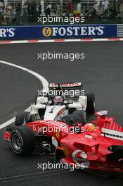 11.09.2005 Spa Francorchamps, Belgium,  Michael Schumacher, GER, Scuderia Ferrari Marlboro, F2005, Action, Track and Takuma Sato, JPN,  BAR Honda crashed at turn 1 - September, Formula 1 World Championship, Rd 16, Belgian Grand Prix, Sunday Race