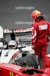 11.09.2005 Spa Francorchamps, Belgium,  Michael Schumacher, GER, Scuderia Ferrari Marlboro, F2005, Action, Track and Takuma Sato, JPN,  BAR Honda crashed at turn 1 - September, Formula 1 World Championship, Rd 16, Belgian Grand Prix, Sunday Race