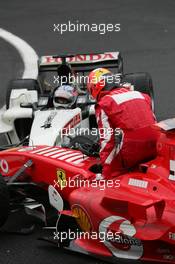 11.09.2005 Spa Francorchamps, Belgium,  Michael Schumacher, GER, Scuderia Ferrari Marlboro, F2005, Action, Track and Takuma Sato, JPN,  BAR Honda crashed at turn 1 - September, Formula 1 World Championship, Rd 16, Belgian Grand Prix, Sunday Race