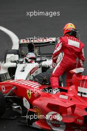 11.09.2005 Spa Francorchamps, Belgium,  Michael Schumacher, GER, Scuderia Ferrari Marlboro, F2005, Action, Track and Takuma Sato, JPN,  BAR Honda crashed at turn 1 - September, Formula 1 World Championship, Rd 16, Belgian Grand Prix, Sunday Race