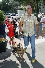 08.09.2005 Spa-Francorchamps, Belgium, Michael Schumacher, GER, Ferrari arrives at the track with his dog Shiva - September, Formula 1 World Championship, Rd 16, Belgian Grand Prix