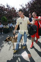 08.09.2005 Spa-Francorchamps, Belgium, Michael Schumacher, GER, Ferrari arrives at the track with his dog Shiva - September, Formula 1 World Championship, Rd 16, Belgian Grand Prix