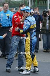 25.09.2005 Sao Paulo, Brazil,  Michael Schumacher, GER, Ferrari congratulates Fernando Alonso, ESP, Renault F1 Team for winning the World Championship - September, Formula 1 World Championship, Rd 17, Brazilian Grand Prix, Sunday Podium