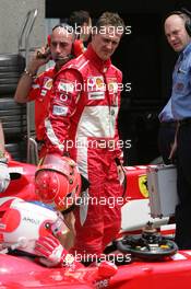 11.06.2005 Montreal, Canada,  Michael Schumacher, GER, Ferrari looks down on Rubens Barrichello, BRA, Ferrari, who failed to make a Qualifying lap- June, Formula 1 World Championship, Rd 8, Canadian Grand Prix, Montreal, CDN, Qualifying