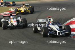 16.10.2005 Shanghai, China,  Mark Webber, AUS, BMW WilliamsF1 Team, FW27, Action, Track leads Jenson Button, GBR, Lucky Strike BAR Honda 007, Action, Track - October, Formula 1 World Championship, Rd 19, Chinese Grand Prix, Sunday Race