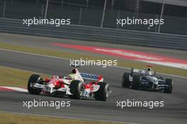 16.10.2005 Shanghai, China,  Ralf Schumacher, GER, Panasonic Toyota Racing, TF105, Action, Track leads Mark Webber, AUS, BMW WilliamsF1 Team, FW27, Action, Track - October, Formula 1 World Championship, Rd 19, Chinese Grand Prix, Sunday Race