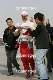 15.10.2005 Shanghai, China,  Ralf Schumacher, GER, Panasonic Toyota Racing signs an autograph - October, Formula 1 World Championship, Rd 19, Chinese Grand Prix, Saturday