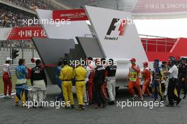 16.10.2005 Shanghai, China,  The drivers get on the bus for the drivers parade - October, Formula 1 World Championship, Rd 19, Chinese Grand Prix, Sunday