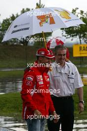 05.05.2005 Barcelona, Spain, FIA Foundation, Bridgestone - Road Safety Campaign - THINK BEFORE YOU DRIVE - Michael Schumacher, GER, Ferrari and Rubens Barrichello, BRA, Ferrari - May, Formula 1 World Championship, Rd 5, Spanish Grand Prix, ESP